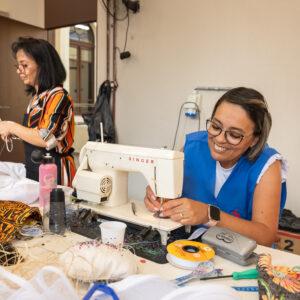 Supported by H360, Tereza’s collaborators who have left the prison system make costumes for musical about Martinho da Vila